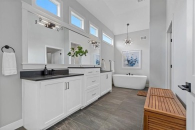 This 4-bedroom, 4-bath reverse 1.5-story is packed with upgrades on Heritage Park Golf Course in Kansas - for sale on GolfHomes.com, golf home, golf lot