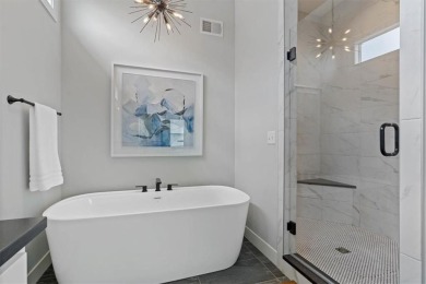 This 4-bedroom, 4-bath reverse 1.5-story is packed with upgrades on Heritage Park Golf Course in Kansas - for sale on GolfHomes.com, golf home, golf lot