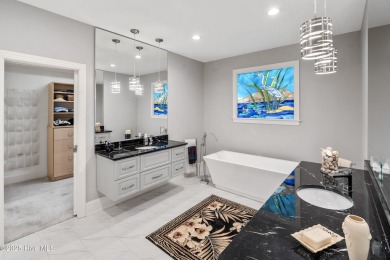 Welcome to 704 Squire Lane, where timeless elegance meets modern on Porters Neck Country Club in North Carolina - for sale on GolfHomes.com, golf home, golf lot