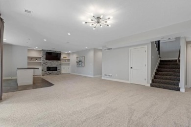 This 4-bedroom, 4-bath reverse 1.5-story is packed with upgrades on Heritage Park Golf Course in Kansas - for sale on GolfHomes.com, golf home, golf lot