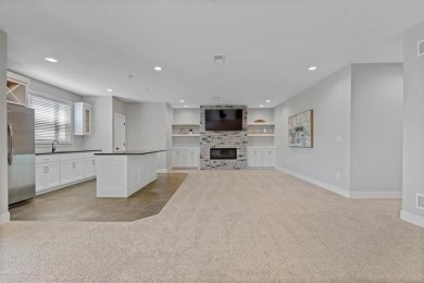 This 4-bedroom, 4-bath reverse 1.5-story is packed with upgrades on Heritage Park Golf Course in Kansas - for sale on GolfHomes.com, golf home, golf lot