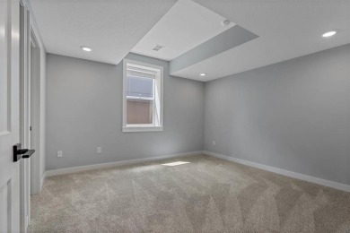 This 4-bedroom, 4-bath reverse 1.5-story is packed with upgrades on Heritage Park Golf Course in Kansas - for sale on GolfHomes.com, golf home, golf lot
