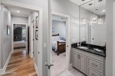 Welcome to 704 Squire Lane, where timeless elegance meets modern on Porters Neck Country Club in North Carolina - for sale on GolfHomes.com, golf home, golf lot