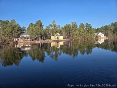 Picturesque Waterfront Lot with stunning views in Woodlake on Woodlake Country Club in North Carolina - for sale on GolfHomes.com, golf home, golf lot