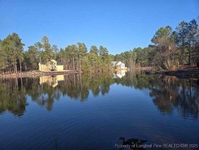 Picturesque Waterfront Lot with stunning views in Woodlake on Woodlake Country Club in North Carolina - for sale on GolfHomes.com, golf home, golf lot