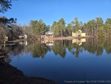 Picturesque Waterfront Lot with stunning views in Woodlake on Woodlake Country Club in North Carolina - for sale on GolfHomes.com, golf home, golf lot