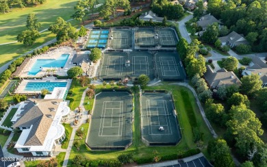 Welcome to 704 Squire Lane, where timeless elegance meets modern on Porters Neck Country Club in North Carolina - for sale on GolfHomes.com, golf home, golf lot
