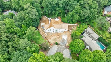 Situated on a private corner of this tree-lined cul-de-sac off on Bobby Jones Golf Club in Georgia - for sale on GolfHomes.com, golf home, golf lot
