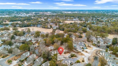 This beautifully remodeled 3-bedroom, 2-bathroom home in on Country Club of Landfall in North Carolina - for sale on GolfHomes.com, golf home, golf lot