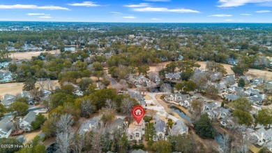 This beautifully remodeled 3-bedroom, 2-bathroom home in on Country Club of Landfall in North Carolina - for sale on GolfHomes.com, golf home, golf lot