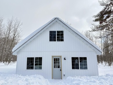 This charming Lakes of the North home has been fully renovated on Lakes of the North Deer Run Golf Course in Michigan - for sale on GolfHomes.com, golf home, golf lot
