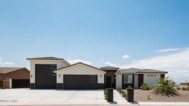 Presenting 6393 S Via De Oro, Fort Mohave, Arizona, a custom on Los Lagos Golf Club in Arizona - for sale on GolfHomes.com, golf home, golf lot