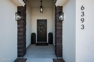 Presenting 6393 S Via De Oro, Fort Mohave, Arizona, a custom on Los Lagos Golf Club in Arizona - for sale on GolfHomes.com, golf home, golf lot