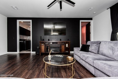 Presenting 6393 S Via De Oro, Fort Mohave, Arizona, a custom on Los Lagos Golf Club in Arizona - for sale on GolfHomes.com, golf home, golf lot