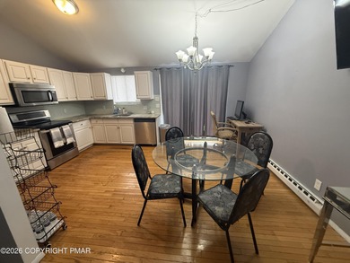 This 4 bedroom, 2 bath split level home sits in an amenity on Pocono Farms Country Club in Pennsylvania - for sale on GolfHomes.com, golf home, golf lot