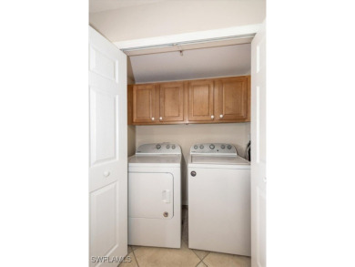 Enjoy serene water views in this bright, first-floor condo in on Bonita Fairways in Florida - for sale on GolfHomes.com, golf home, golf lot