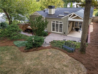 Nestled on a quiet street in sought-after Collier Hills, this on Bobby Jones Golf Club in Georgia - for sale on GolfHomes.com, golf home, golf lot