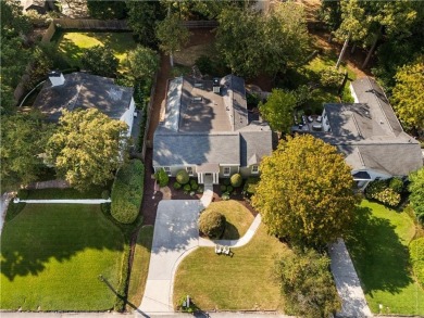 Nestled on a quiet street in sought-after Collier Hills, this on Bobby Jones Golf Club in Georgia - for sale on GolfHomes.com, golf home, golf lot