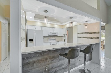 Step into your own slice of paradise with this beautifully on Pinemoor West Golf Club in Florida - for sale on GolfHomes.com, golf home, golf lot