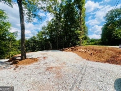 Beautiful view of mountains and water from this unrestricted lot on Currahee Golf Club in Georgia - for sale on GolfHomes.com, golf home, golf lot