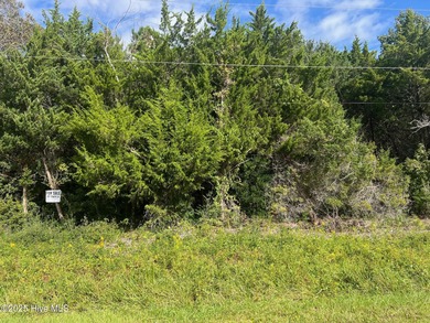 This beautiful canal-front lot on Sunrise Drive is just minutes on North River Club in North Carolina - for sale on GolfHomes.com, golf home, golf lot