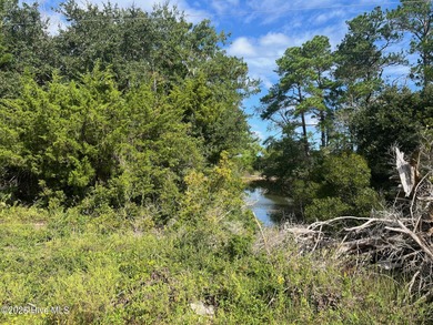 This beautiful canal-front lot on Sunrise Drive is just minutes on North River Club in North Carolina - for sale on GolfHomes.com, golf home, golf lot