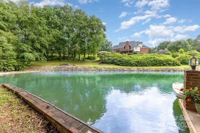 Endless possibilities! Make this waterfront retreat your primary on Woodbridge Golf Links in North Carolina - for sale on GolfHomes.com, golf home, golf lot