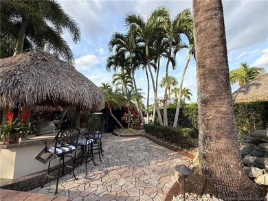 Discover a true g?m th?t r?define? luxur? and outdoor living! on St. Lucie Trail Golf Club in Florida - for sale on GolfHomes.com, golf home, golf lot