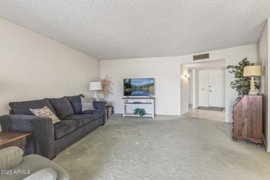 FURNISHED AND READY FOR YOU!!  This sunny, bright end unit in on Stardust Golf Course in Arizona - for sale on GolfHomes.com, golf home, golf lot