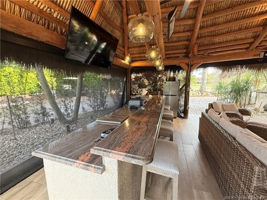 Discover a true g?m th?t r?define? luxur? and outdoor living! on St. Lucie Trail Golf Club in Florida - for sale on GolfHomes.com, golf home, golf lot