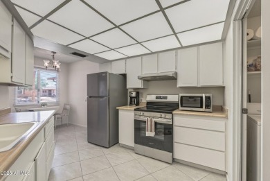 FURNISHED AND READY FOR YOU!!  This sunny, bright end unit in on Stardust Golf Course in Arizona - for sale on GolfHomes.com, golf home, golf lot