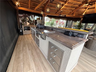 Discover a true g?m th?t r?define? luxur? and outdoor living! on St. Lucie Trail Golf Club in Florida - for sale on GolfHomes.com, golf home, golf lot