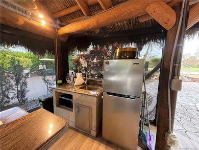 Discover a true g?m th?t r?define? luxur? and outdoor living! on St. Lucie Trail Golf Club in Florida - for sale on GolfHomes.com, golf home, golf lot