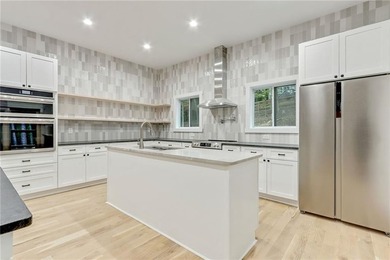 This stunning new construction blends luxury, functionality, and on The Highlands Course at Lake Arrowhead in Georgia - for sale on GolfHomes.com, golf home, golf lot