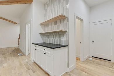 This stunning new construction blends luxury, functionality, and on The Highlands Course at Lake Arrowhead in Georgia - for sale on GolfHomes.com, golf home, golf lot