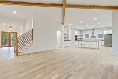 This stunning new construction blends luxury, functionality, and on The Highlands Course at Lake Arrowhead in Georgia - for sale on GolfHomes.com, golf home, golf lot