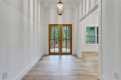 This stunning new construction blends luxury, functionality, and on The Highlands Course at Lake Arrowhead in Georgia - for sale on GolfHomes.com, golf home, golf lot