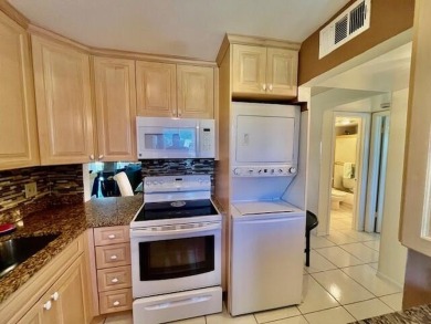 Immaculate, airy, bright turnkey condo (includes all furniture on Fountains Golf and Country Club in Florida - for sale on GolfHomes.com, golf home, golf lot
