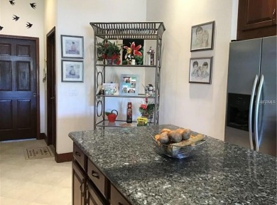 A beautiful LAKE FRONT home in the exclusive Gated Estates of on DeBary Golf and Country Club in Florida - for sale on GolfHomes.com, golf home, golf lot