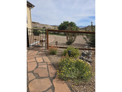 Where views, nature and comfort collide in perfect harmony on on The Golf Club At Redlands Mesa in Colorado - for sale on GolfHomes.com, golf home, golf lot