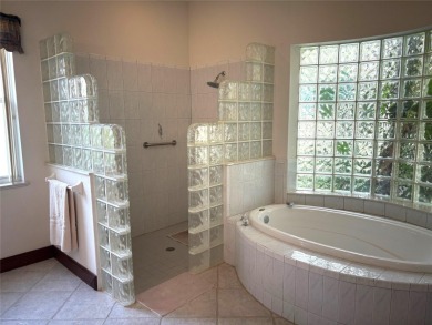 A beautiful LAKE FRONT home in the exclusive Gated Estates of on DeBary Golf and Country Club in Florida - for sale on GolfHomes.com, golf home, golf lot