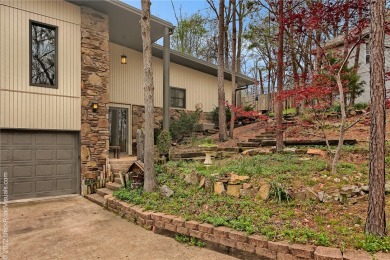 A unique blend of wood and stone surround and create this home on Bella Vista Country Club - Berksdale in Arkansas - for sale on GolfHomes.com, golf home, golf lot