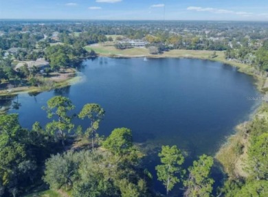 A beautiful LAKE FRONT home in the exclusive Gated Estates of on DeBary Golf and Country Club in Florida - for sale on GolfHomes.com, golf home, golf lot