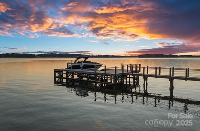 Luxurious Waterfront Retreat in The Point! Perfectly blending on Trump National Golf Club Charlotte in North Carolina - for sale on GolfHomes.com, golf home, golf lot