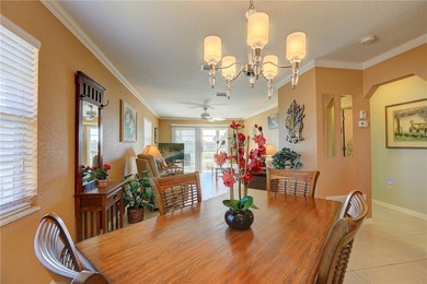 Cozy Plan B 2-bed/2-bath condo with panoramic golf and lake on The American Golf Club in Florida - for sale on GolfHomes.com, golf home, golf lot