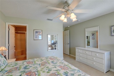 Cozy Plan B 2-bed/2-bath condo with panoramic golf and lake on The American Golf Club in Florida - for sale on GolfHomes.com, golf home, golf lot