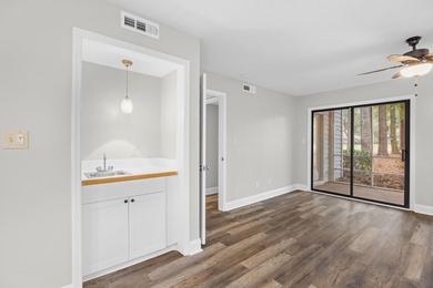 Located within Weehawka Woods in Pawleys Plantation, this condo on Pawleys Plantation Golf and Country Club in South Carolina - for sale on GolfHomes.com, golf home, golf lot