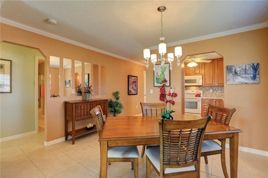Cozy Plan B 2-bed/2-bath condo with panoramic golf and lake on The American Golf Club in Florida - for sale on GolfHomes.com, golf home, golf lot