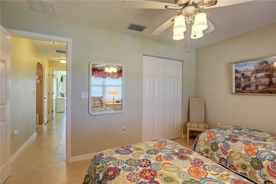 Cozy Plan B 2-bed/2-bath condo with panoramic golf and lake on The American Golf Club in Florida - for sale on GolfHomes.com, golf home, golf lot