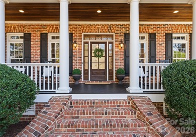 Timeless Southern charm meets lake living! Situated on a large on Trump National Golf Club Charlotte in North Carolina - for sale on GolfHomes.com, golf home, golf lot